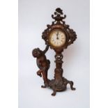 An early 20th century French spelter mantel clock with putti detail.