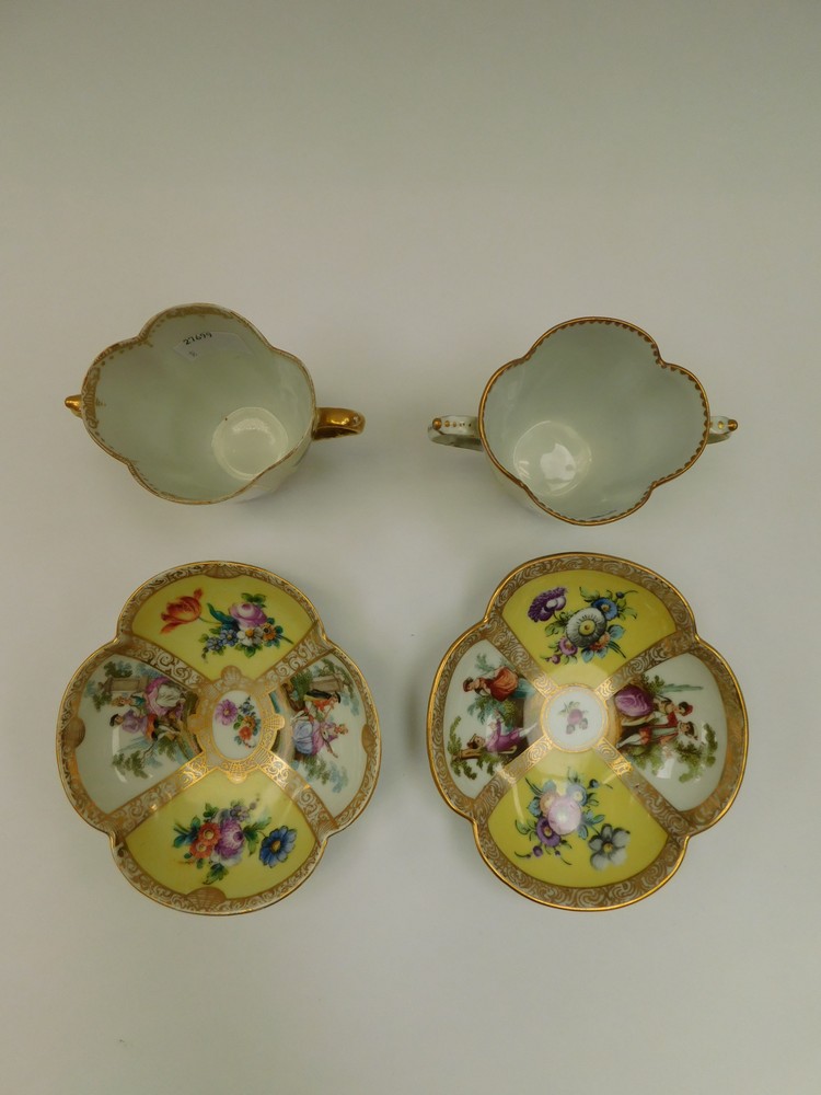 Two Dresden quatrefoil twin-handled chocolate cups and saucers, with two yellow ground panels - Image 2 of 2
