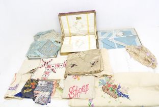 A collection of linen and table wear to include a set of dorma embroidered pillow cases in