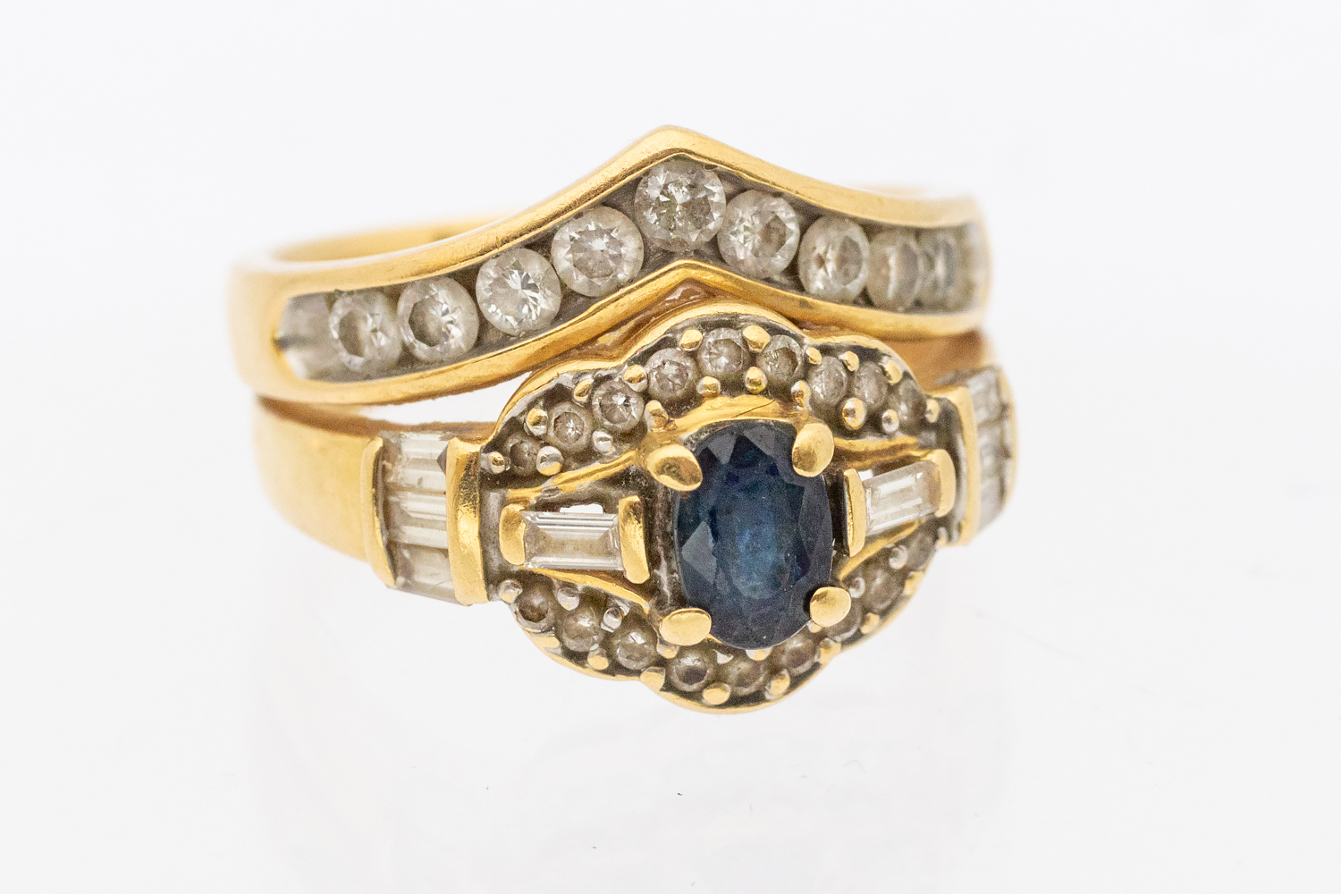 A sapphire and diamond  18ct gold ring with an attached diamond set wishbone, width approx 14mm,