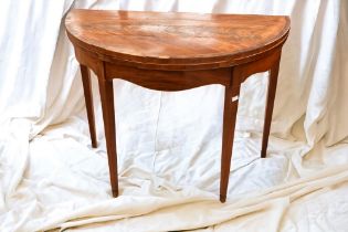 A George III half round mahogany card table.