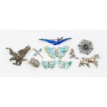 A collection of silver and enamel brooches including two small butterfly's along with a larger