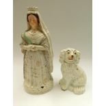 A Staffordshire figure of an early Victoria along with a Staffordshire dog, figure cracked