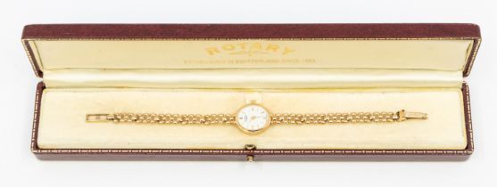 A ladies 9ct gold Rotary wristwatch, comprising a white oval dial with applied baton markers, case