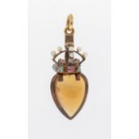 A late Victorian citrine and gold heart and crown pendant, comprising a heart shaped citrine with