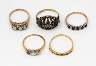 A collection of gold rings to include opal and diamond, sapphire and diamond, ruby and diamond all