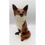 Beswick - A fireside Fox, circular factory mark to the base.