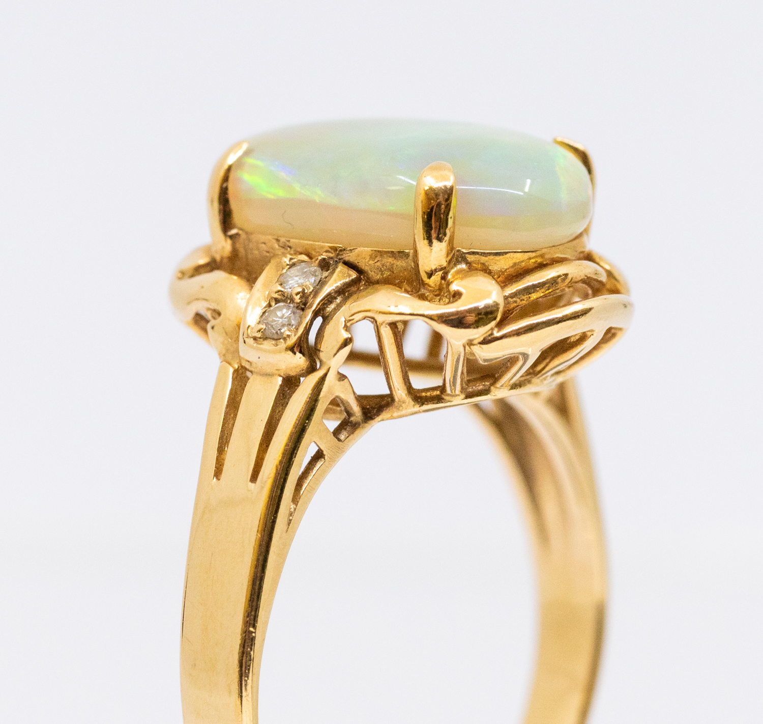 An opal and diamond 14ct gold ring, comprising an oval opal approx 9x9mm, with orange, green and - Image 5 of 5