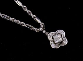 A diamond and 18ct white gold pendant, comprising a quatrefoil design set to the centre with four
