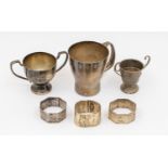 A collection of silver items to include; an Elizabeth II silver christening mug of stylish modernist