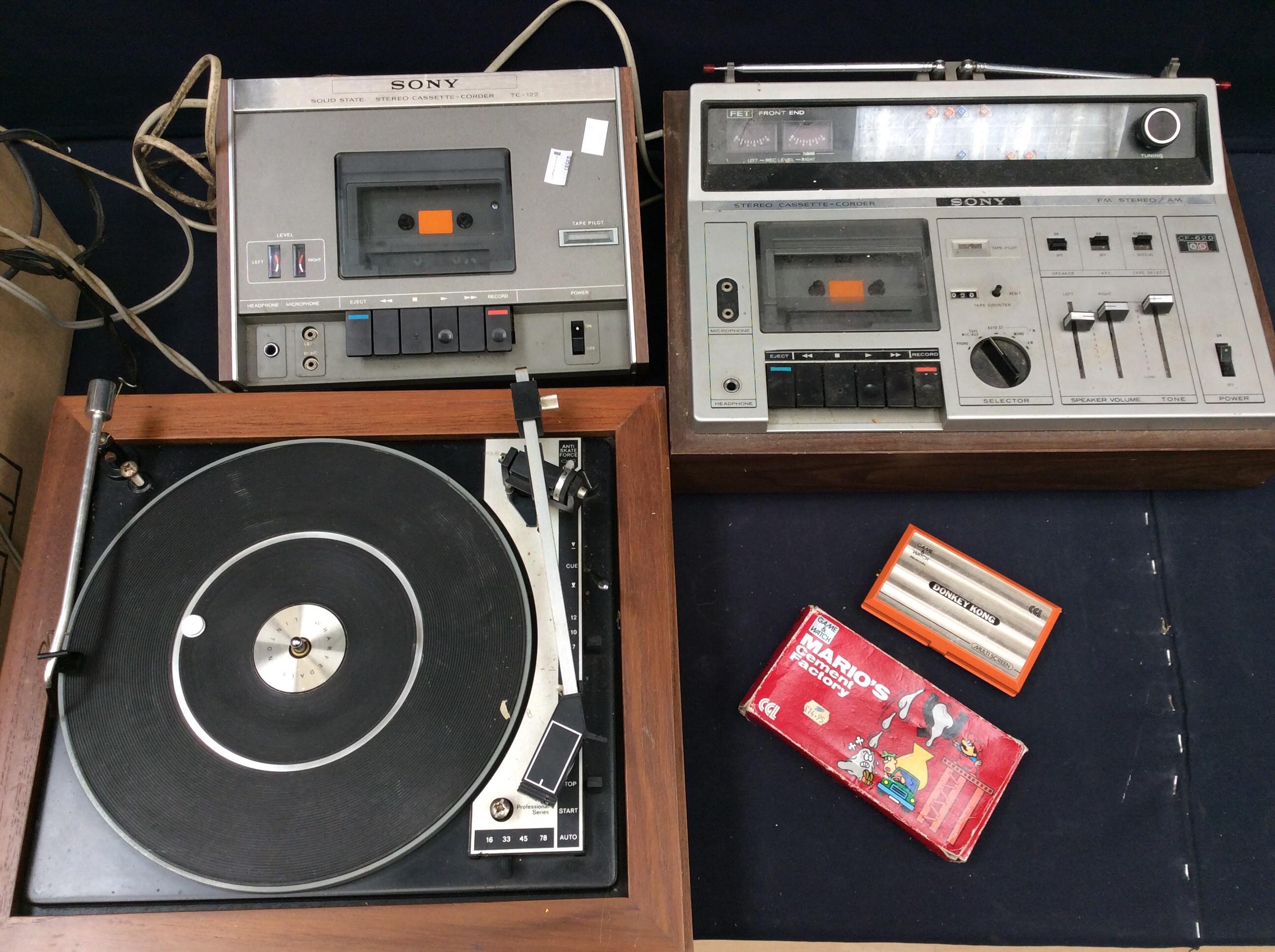 A vintage Super Mario game Nintendo Donkey Kong along with Sony tape decs and record player.