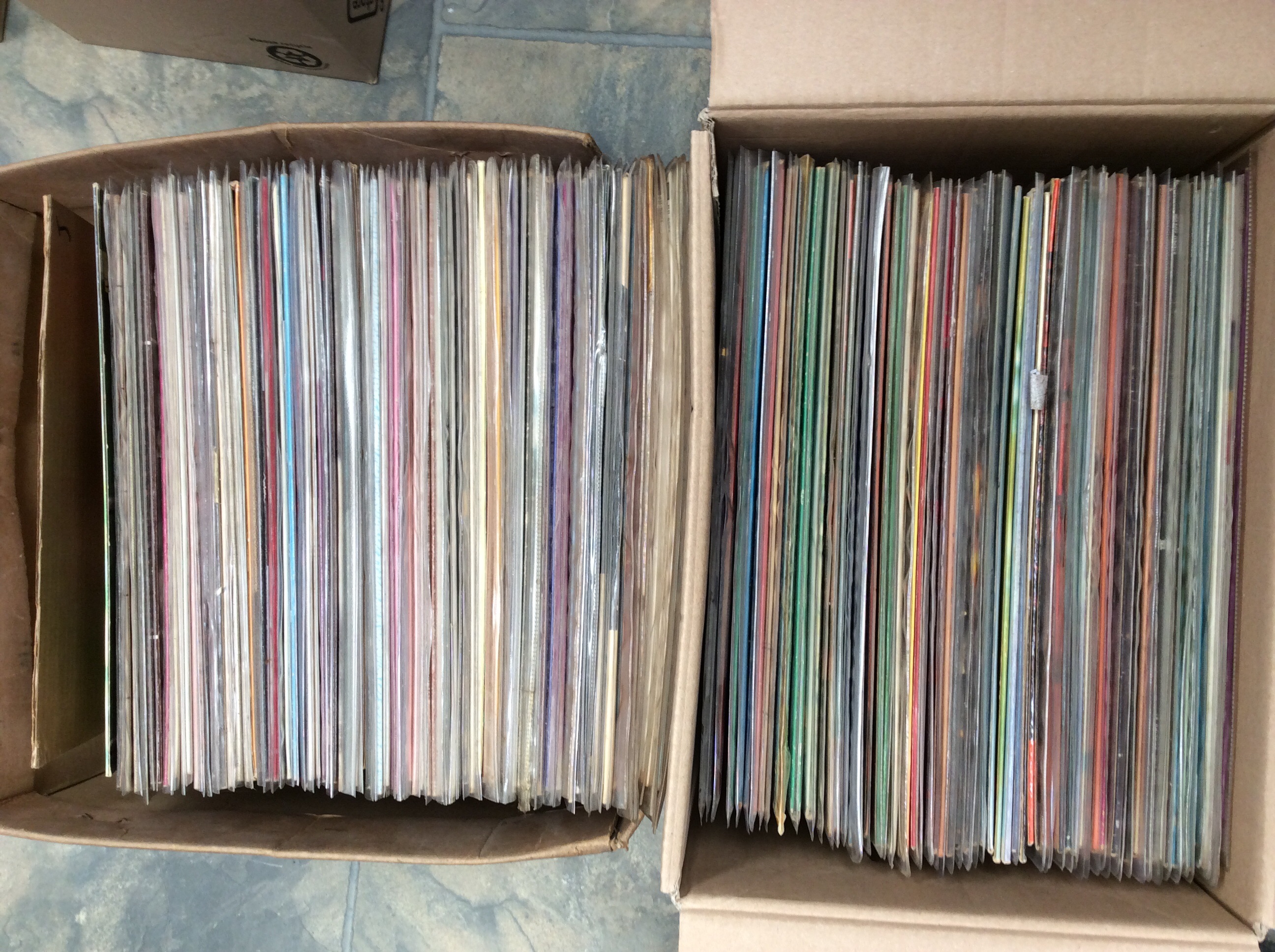 Two boxes of LPs to include Jive Bunny, Spike Jones, James Last etc.