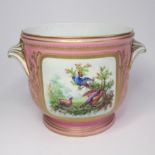 A 19th Century French pink ground porcelain cache pot, painted with a bird scene on one side and a