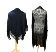 A black silk mowry shawl, early 1900s, embroidered corner and silk tassels (some holes), a black