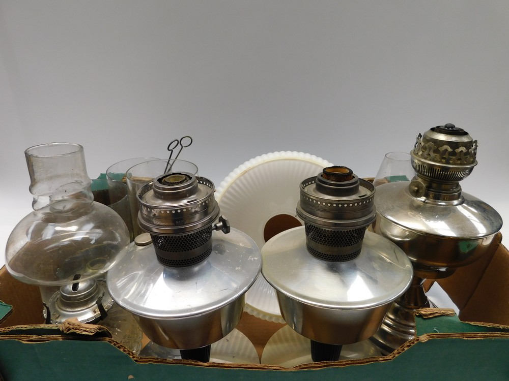 A quantity of mid 20th Century oil lamps, brass, glass and stainless steel with funnels. - Bild 2 aus 2