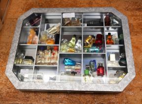 A collection of miniature forty-one and sample perfume bottles, comprising vintage and later