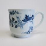 A Liverpool blue and white cup, decorated with a bird and flower sprays Circa 1776 Diameter 6cm,