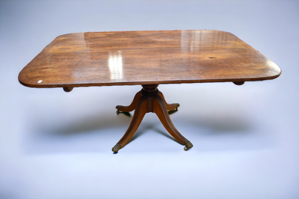 A Regency tilt top table in mahogany