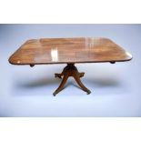 A Regency tilt top table in mahogany
