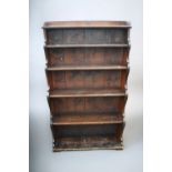 A 19th Century stained pine waterfall style five shelf book stand, 142cm x 82cm.