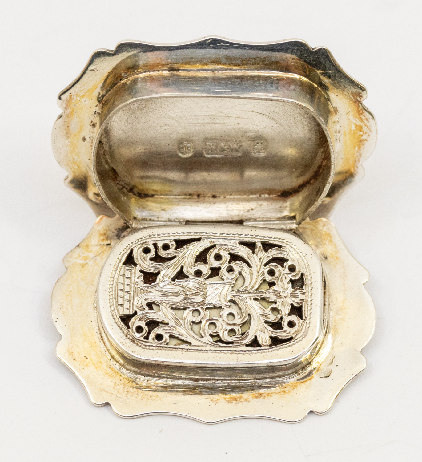 A Victorian silver cartouche shaped vinaigrette, profusely engraved with scrolling foliage, the - Image 2 of 2