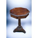 An octagonal occasional table on tripod feet, in mahogany, crack to top, missing one drawer