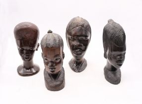 Four hardwood carved East African heads of Tribal women.