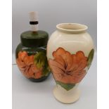 A 1980's Moorcroft vase in the Coral Hibiscus Ivory Design vase together with a 1970's Moorcroft