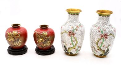 A pair of early 20th century cloisonne vases, of rounded form with red enamel colourway and gilt