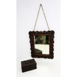 A Chinese early 20th Century carved hardwood mirror along with an Indian carved hardwood trinket