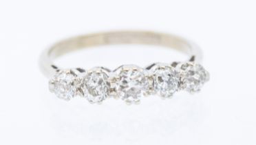 A five stone diamond 18ct gold ring, (rhodium plated) comprising five old cut claw set diamonds,