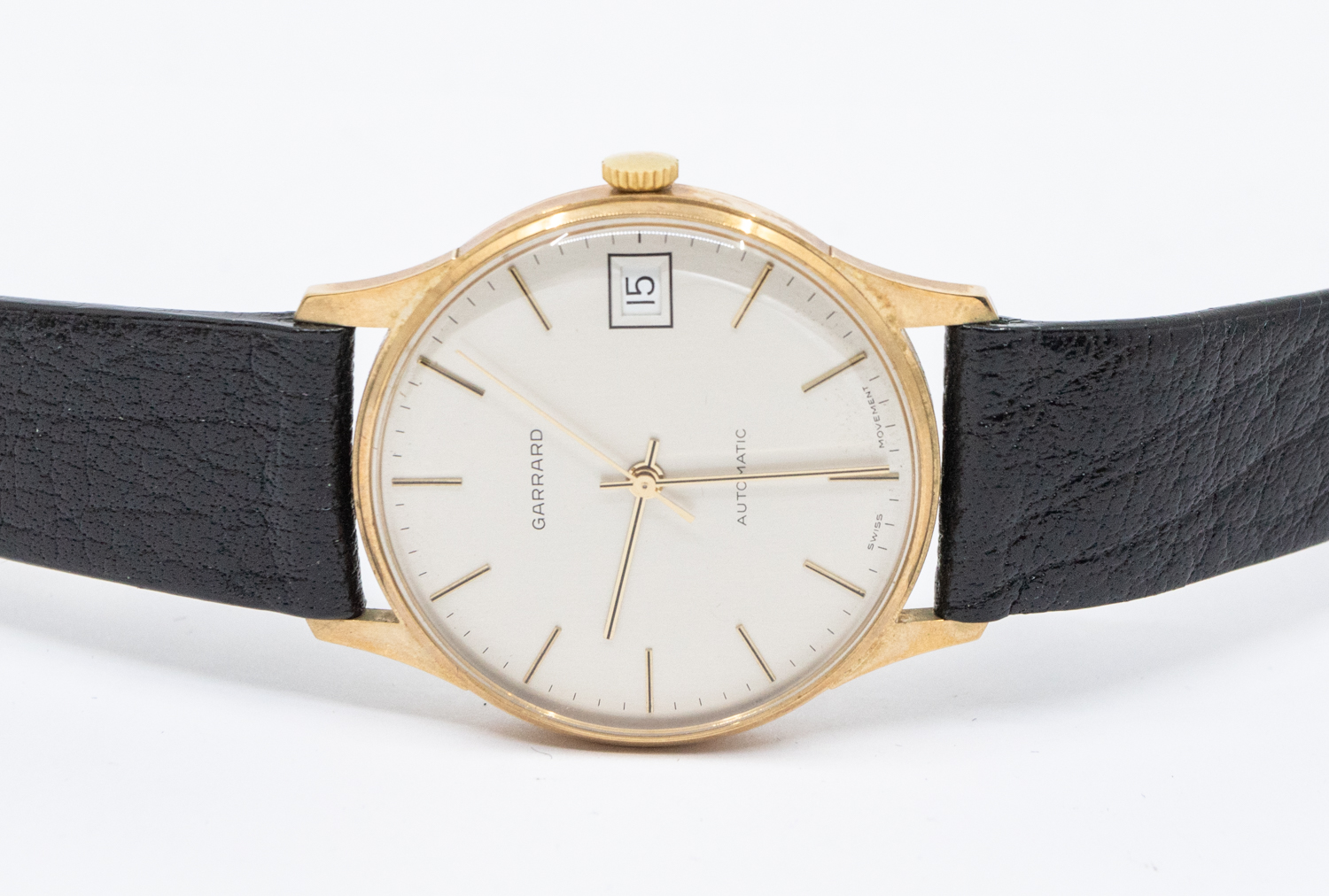 Garrard- a gentleman's 9ct gold Garrard automatic wristwatch, comprising a signed silvered dial with