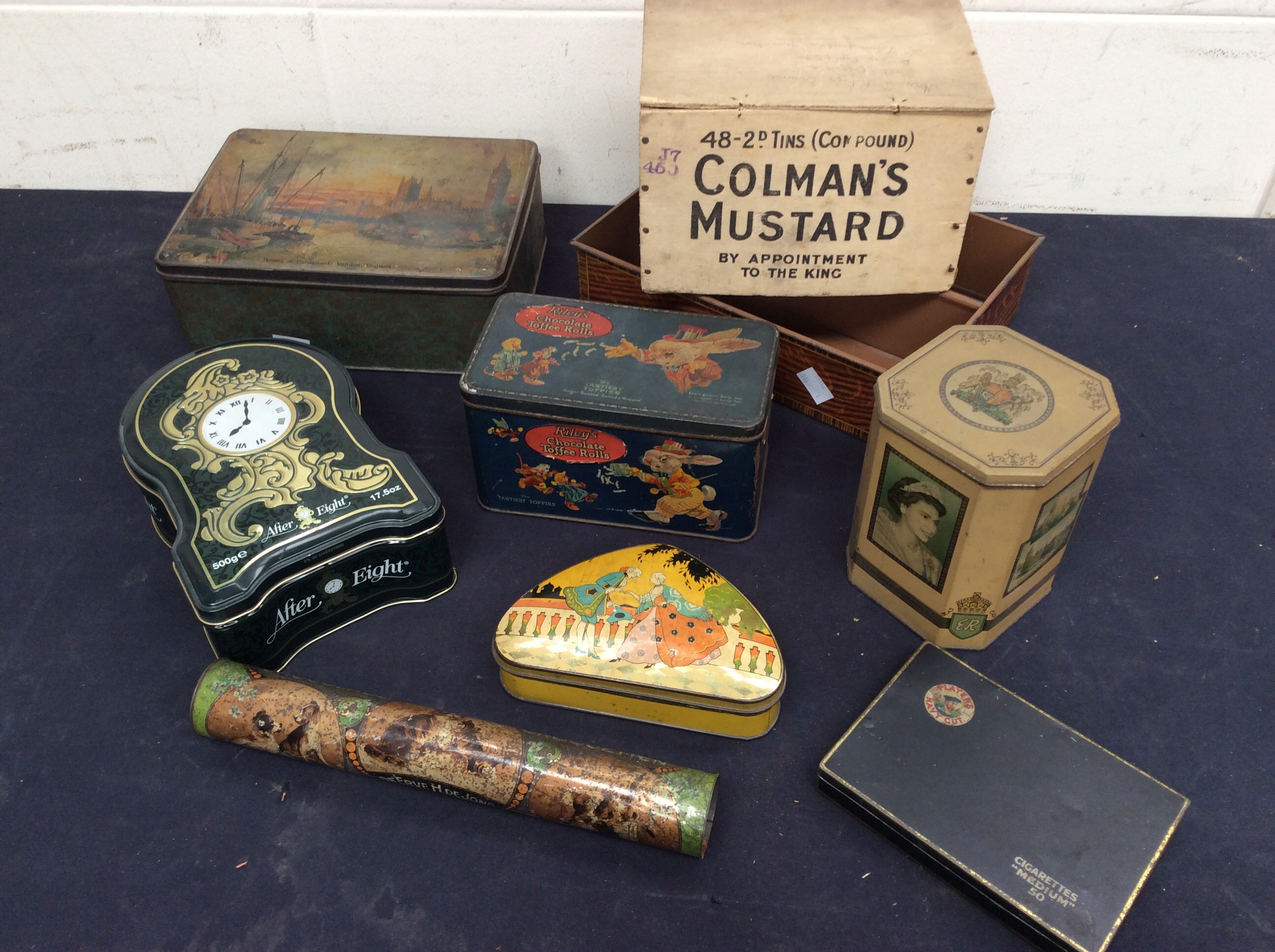 A mixed collection of early to mid 20th Century advertising tins.