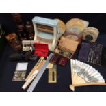 A mixed collection of collector's items to include treen boxes, wooden figures, cigarette box,