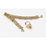 A 9ct gold fancy link gate bracelet, width approx 9mm, length approx 18.5cm, padlock clasp detached,