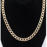 A 9ct gold curb link chain, width approx 7mm, length approx 51cm, weight approx 31.4gms  Further