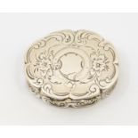 A Victorian silver shaped oval vinaigrette, scalloped border, engraved with flowers and foliage, the