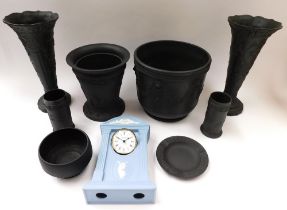 A collection of black Wedgewood to include vase, planter, pots and ashtray along with a Wedgewood