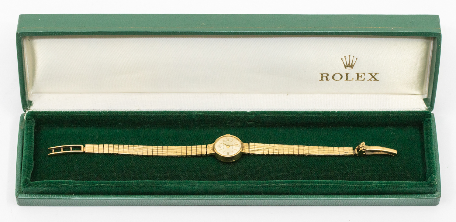 Rolex: a Ladies 9ct gold vintage Rolex wristwatch, comprising a round silvered signed dial with