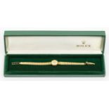Rolex: a Ladies 9ct gold vintage Rolex wristwatch, comprising a round silvered signed dial with