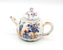 A Chinese Imari ribbed teapot, Kangxi period (1662-1722), the body decorated with two figures on a