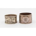 A Chinese silver napkin ring, with relief Chinese script to sides and initialled circular cartouche,