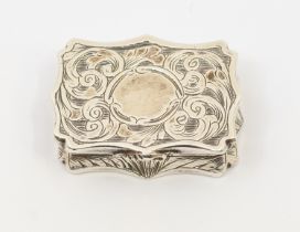 An early Victorian silver shaped rectangular vinaigrette, wavy border, the entire engraved with