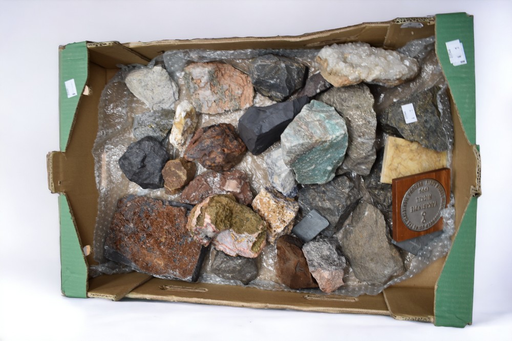 A collection of various rocks and minerals including ruby crystals in granite, azurite, calcite,