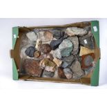 A collection of various rocks and minerals including ruby crystals in granite, azurite, calcite,
