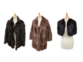 A 1950s dark fur 3/4 jacket together with a 1950s 3/4 musquash fur coat, cowl collar and a black