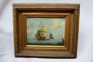 A 20th Century print on canvas in reproduction gilt frame of Galleons on sea.