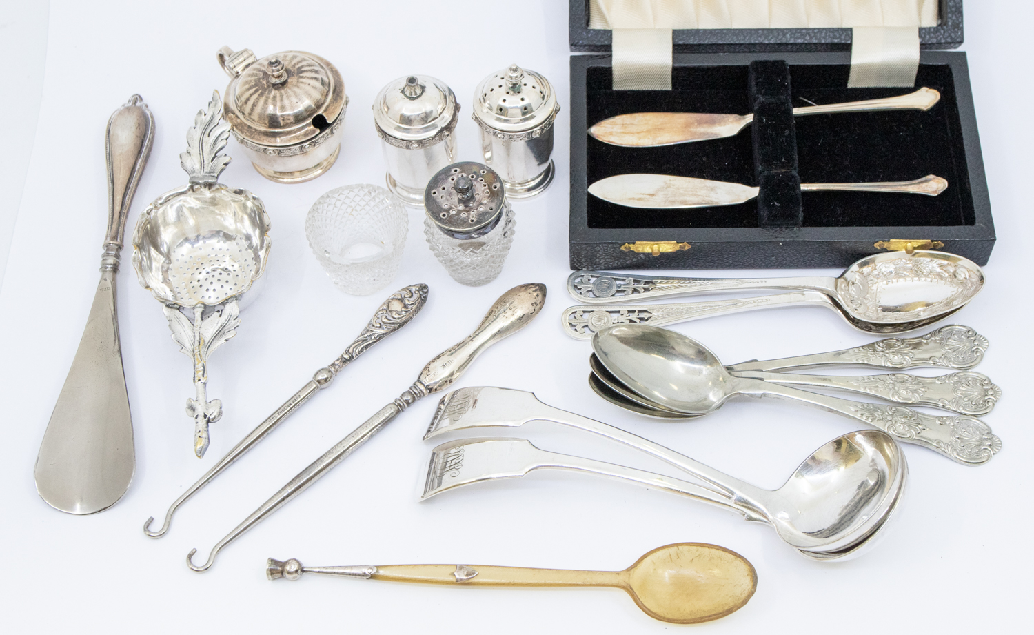 A small collection of silver and plated items to include; a matching Elizabeth II silver cruet set