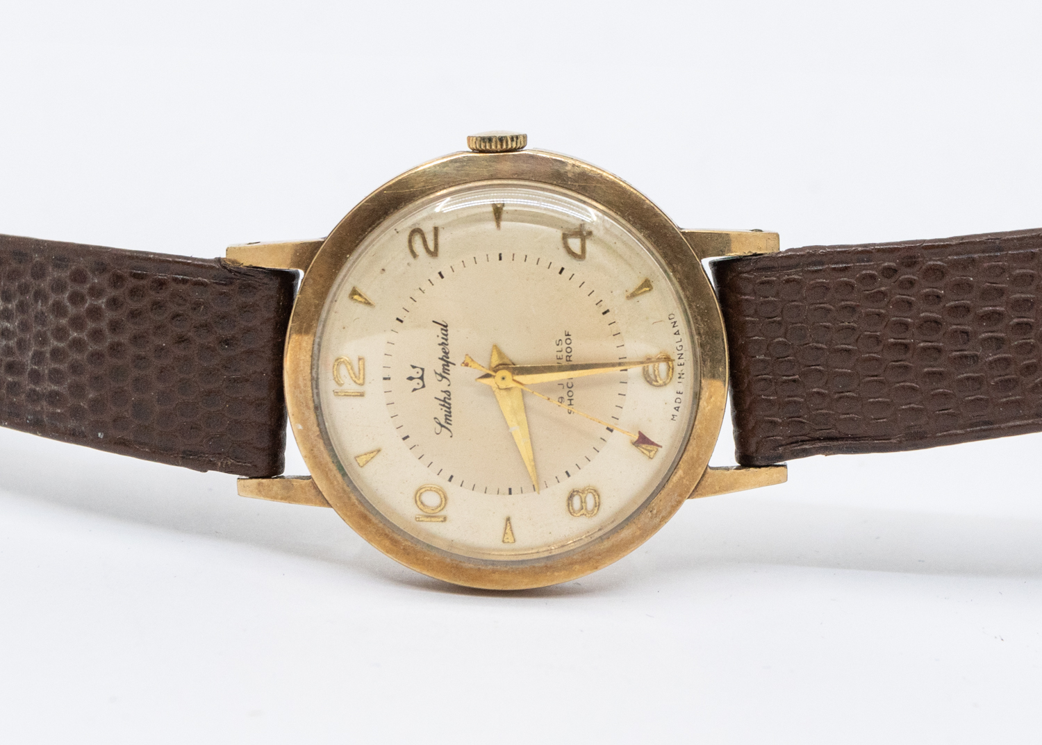A gents vintage 9ct gold Smith Imperial wristwatch, circa 1950's, comprising a signed champagne dial