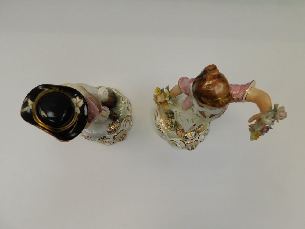 Two Royal Crown Derby porcelain figures "winter and spring" painted by S Whitehead, damage to leaf - Image 2 of 4